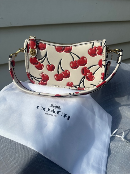 Coach Handbags - Coach Swinger 20 Shoulder Bag in Chalk Leather with Cherry Print